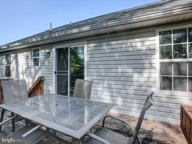 a view of a yard with a wooden fence