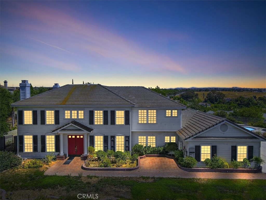 14172 Andy Place Riverside, CA 92508 - Photo 1 of 1 a front view of a house with yard and green space