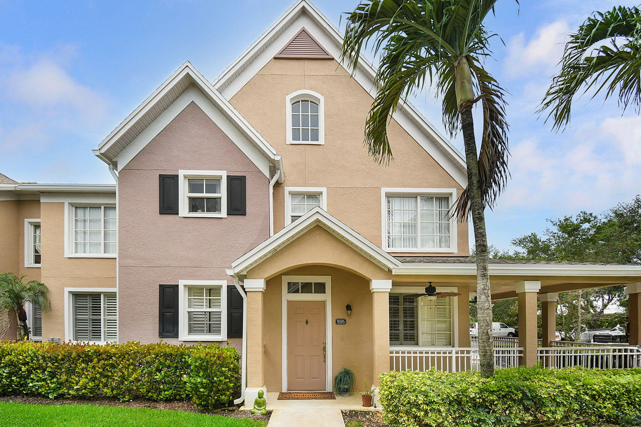 front view of a house with a yard