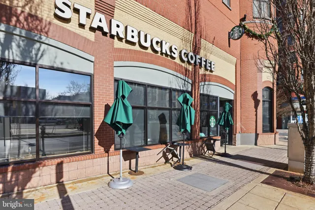 a view of a chairs and table in the balcony