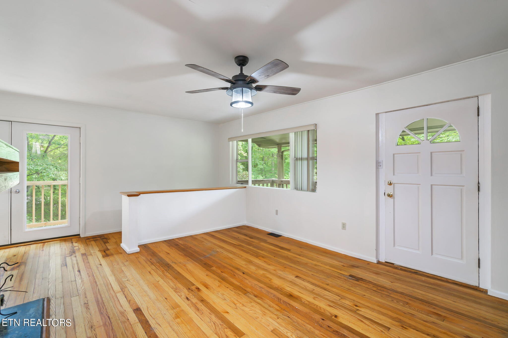 408 Delaware Avenue Oak Ridge, TN 37830 - Photo 12 of 35 a view of empty room with wooden floor and fan