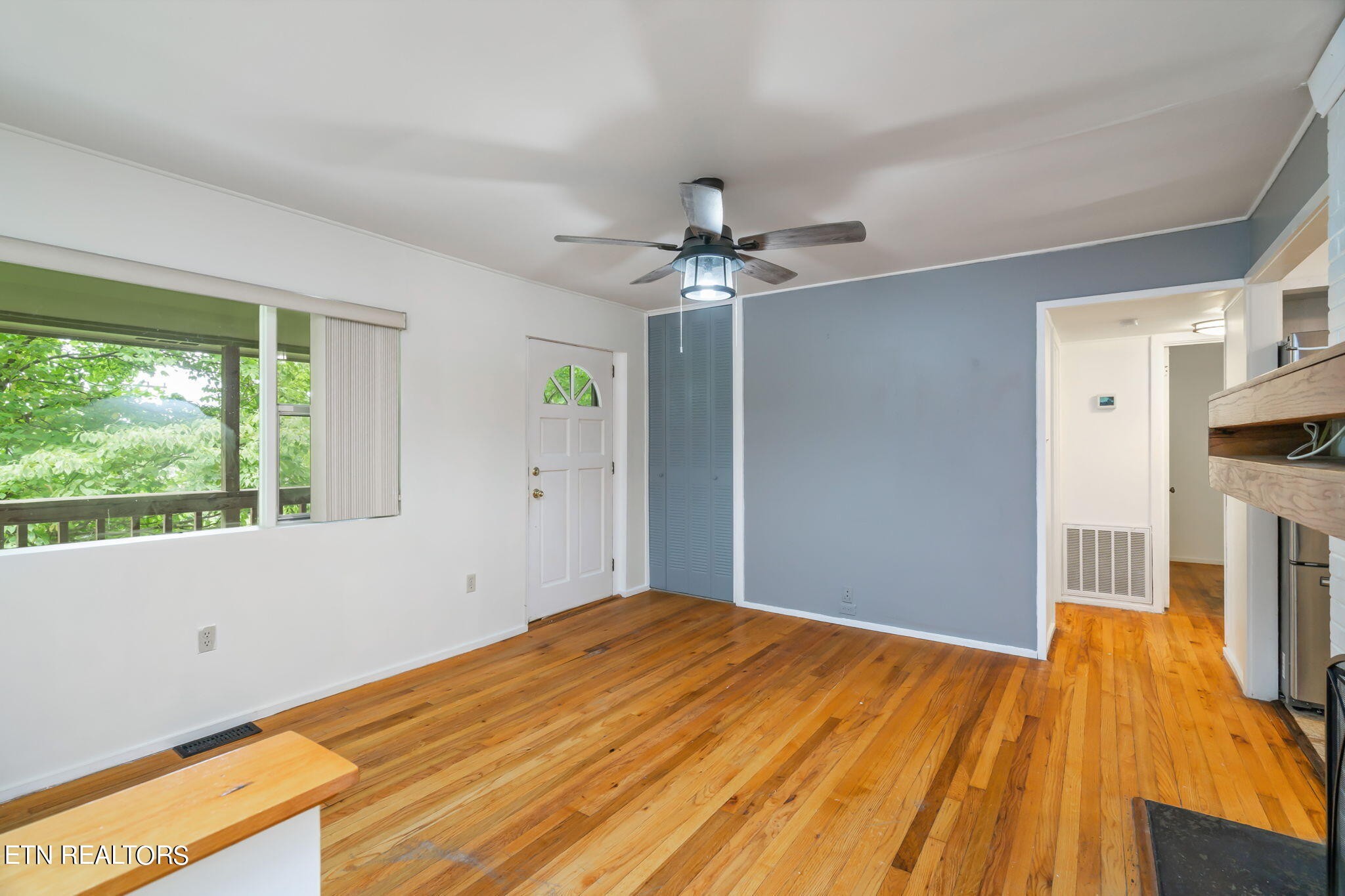 408 Delaware Avenue Oak Ridge, TN 37830 - Photo 14 of 35 a bedroom with a bed and a ceiling fan