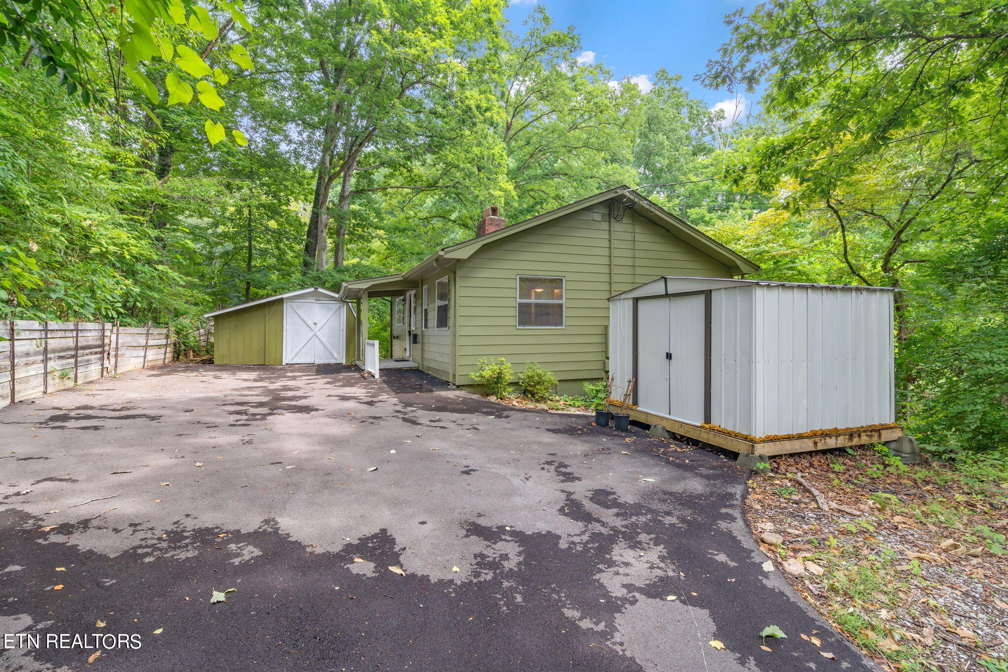 408 Delaware Avenue Oak Ridge, TN 37830 - Photo 30 of 35 a view of a house with a yard and garage