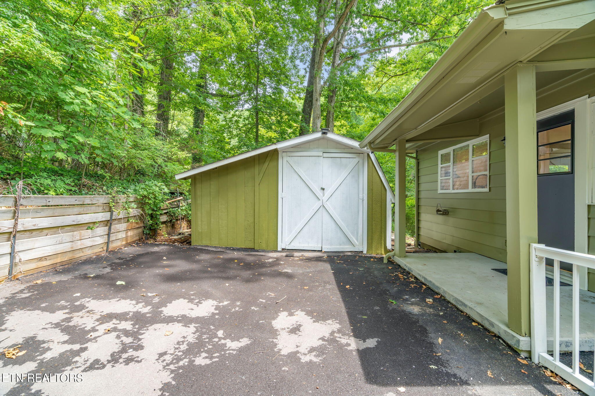 408 Delaware Avenue Oak Ridge, TN 37830 - Photo 31 of 35 a view of backyard with a barn and a cactus plant