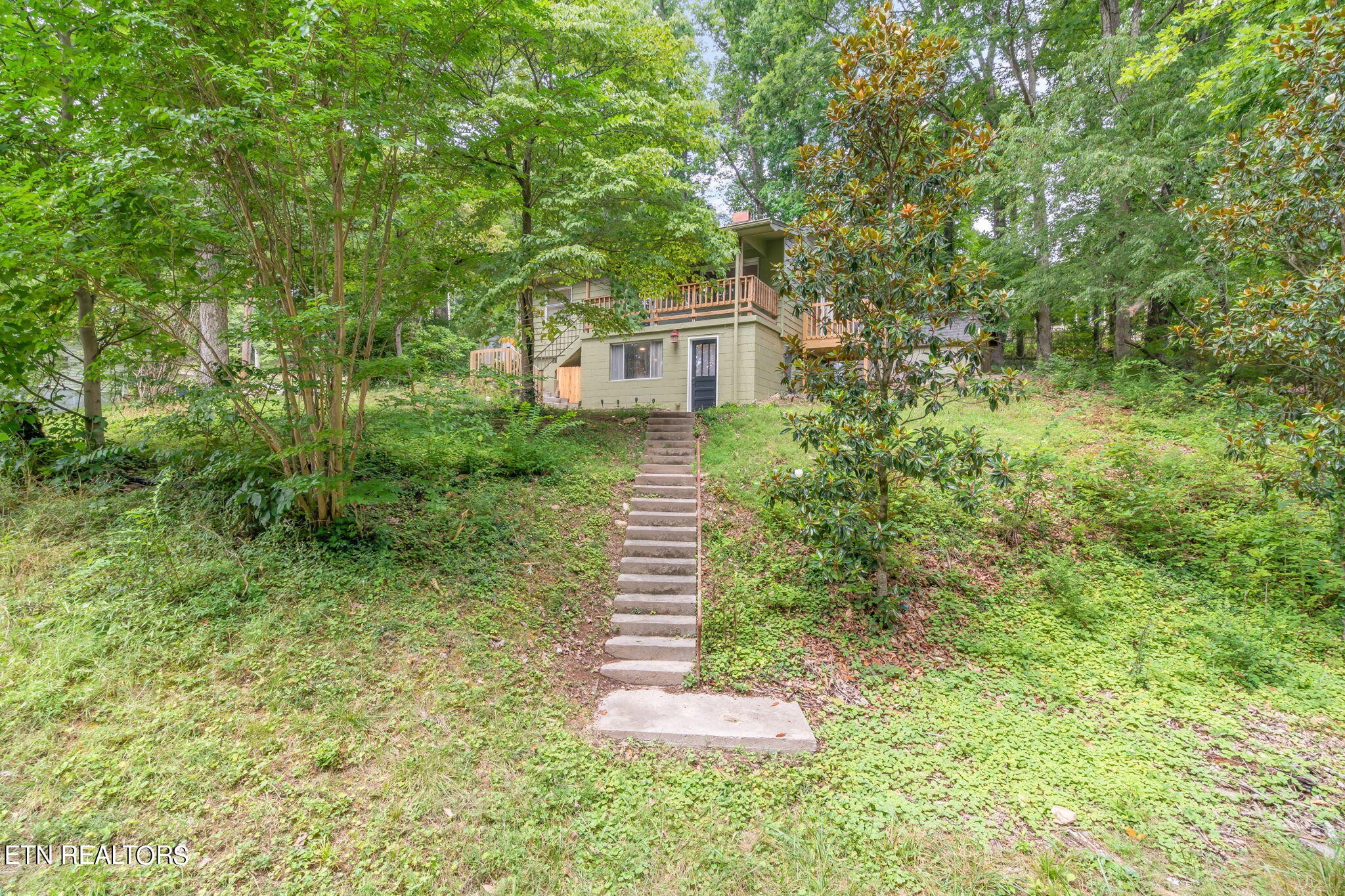 408 Delaware Avenue Oak Ridge, TN 37830 - Photo 33 of 35 a front view of a house with a yard