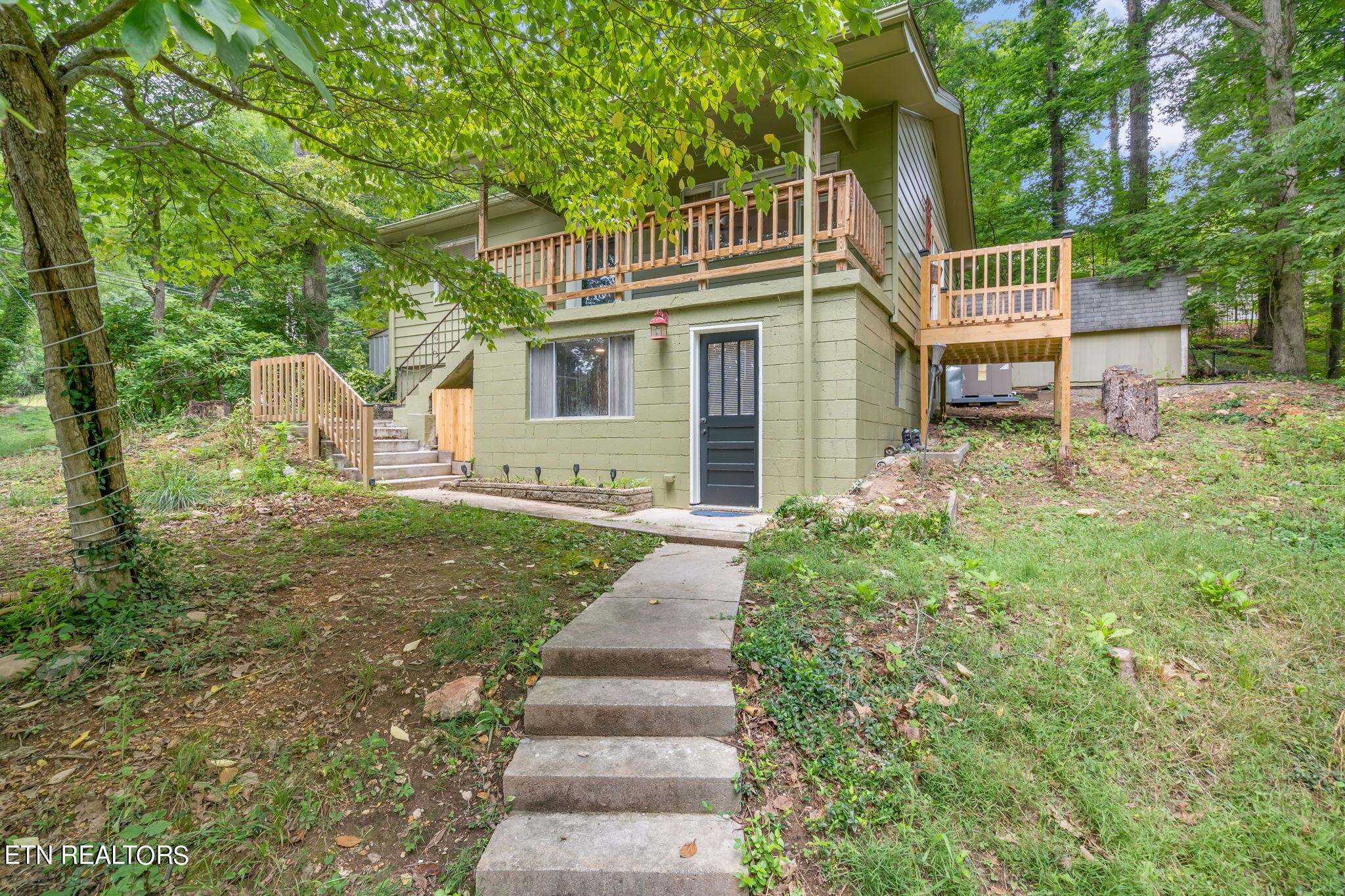 408 Delaware Avenue Oak Ridge, TN 37830 - Photo 34 of 35 a front view of a house with garden
