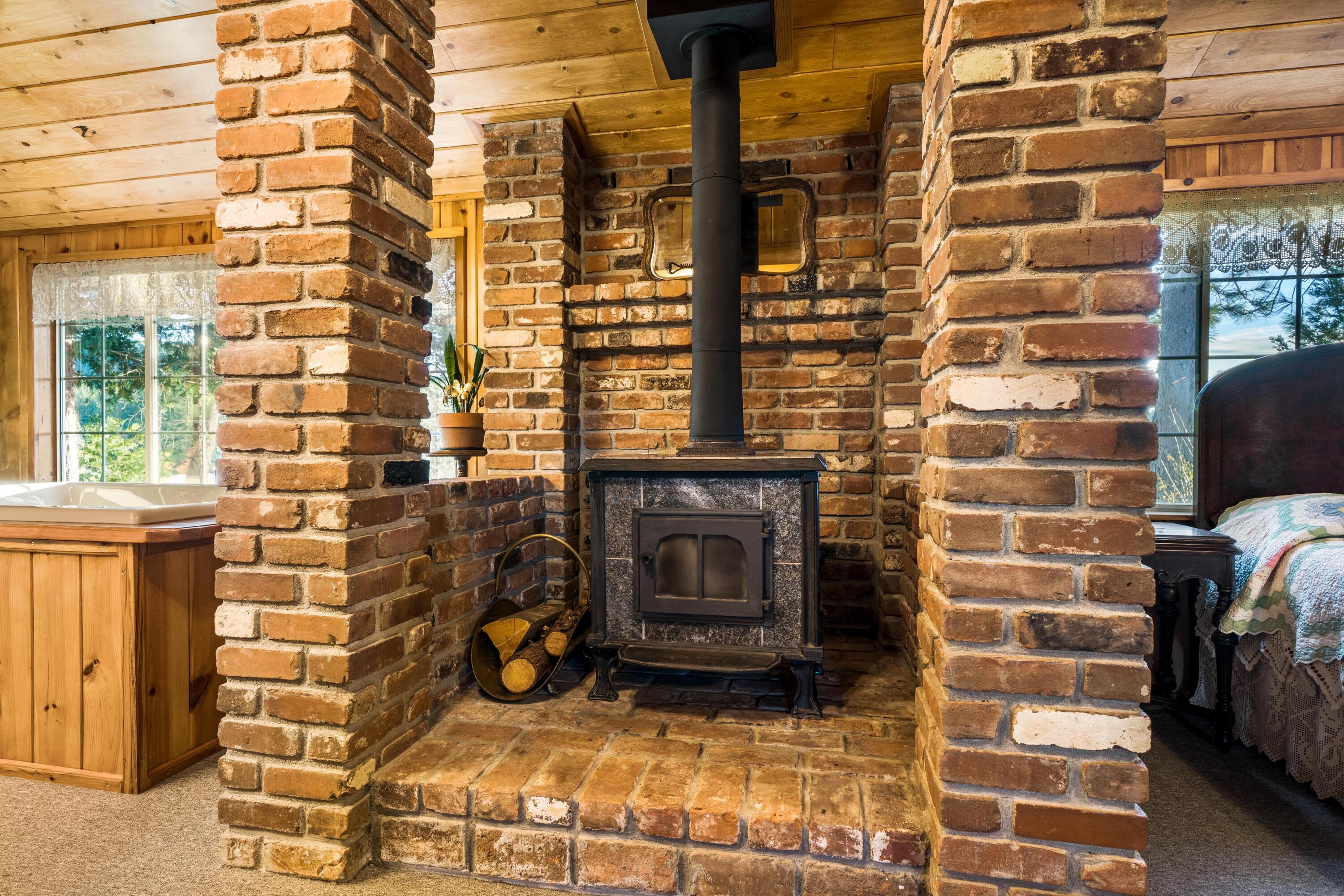 30260 Oak Run To Fern Road Oak Run, CA 96069 - Photo 34 of 76 a view of a fireplace with a door and brick walls