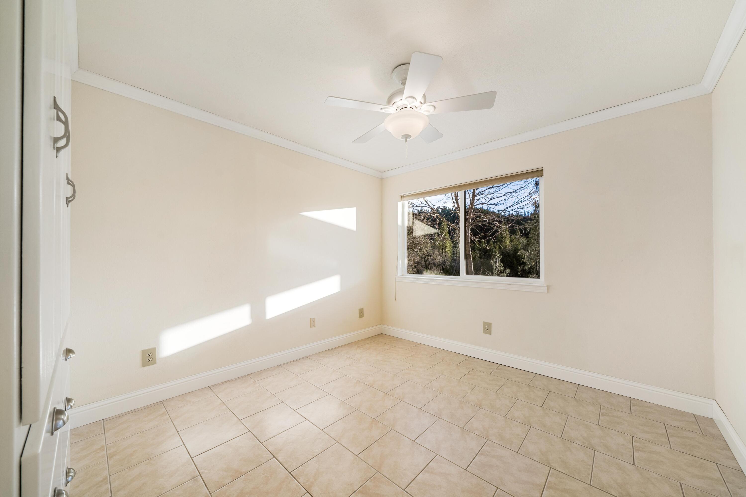 30260 Oak Run To Fern Road Oak Run, CA 96069 - Photo 48 of 76 an empty room with windows and fan