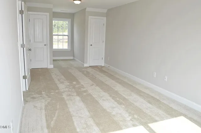 an empty room with closet area