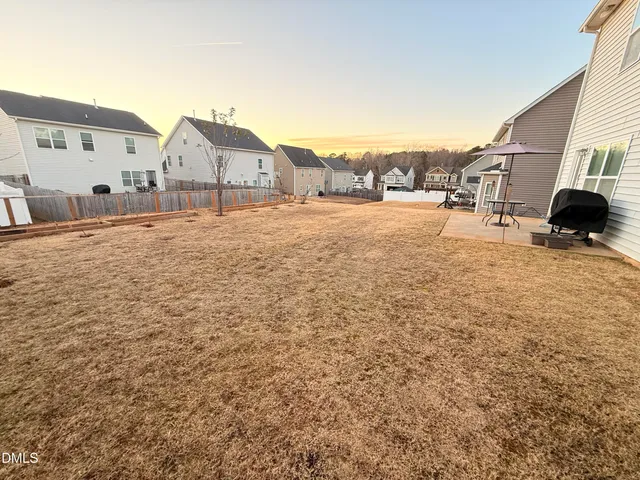 a balcony with furniture and a potted plant