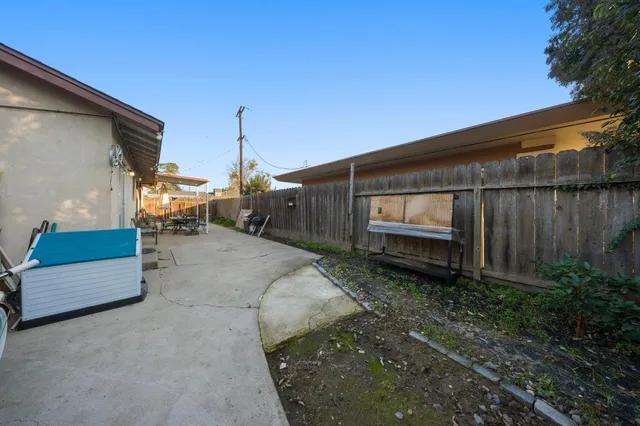 a backyard of a house with lots of green space