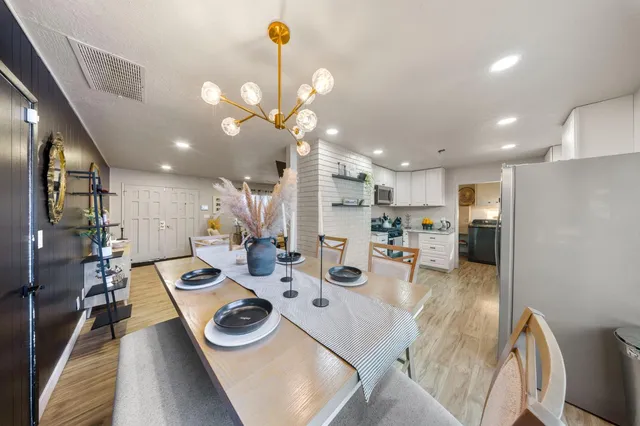 a kitchen with stainless steel appliances furniture and a view of kitchen