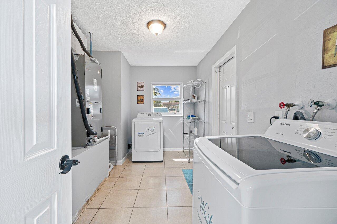 1250 Southwest 6th Avenue Deerfield Beach, FL 33441 - Photo 11 of 22 a room with a washing machine and sink