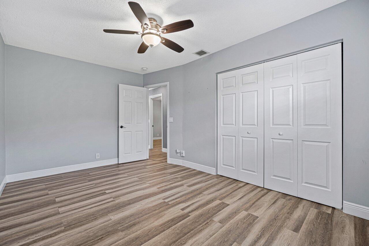 1250 Southwest 6th Avenue Deerfield Beach, FL 33441 - Photo 17 of 22 a view of an empty room and wooden floor