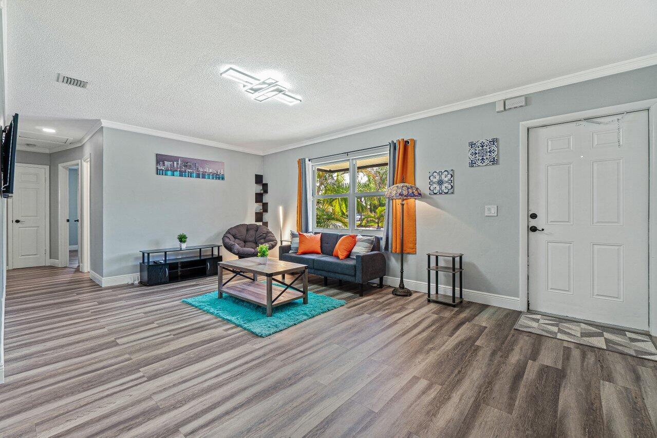 1250 Southwest 6th Avenue Deerfield Beach, FL 33441 - Photo 4 of 22 a living room with furniture and a wooden floor