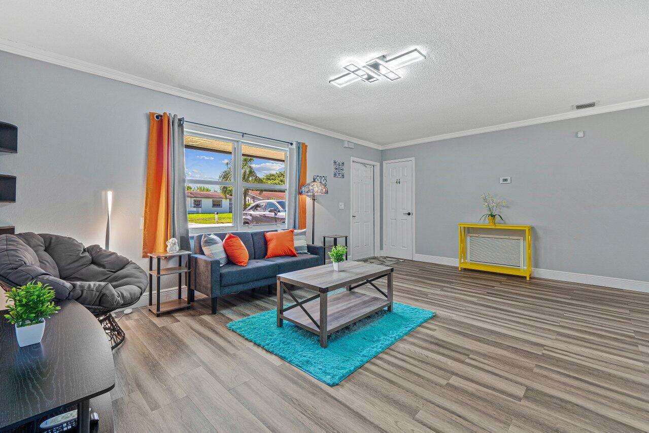 1250 Southwest 6th Avenue Deerfield Beach, FL 33441 - Photo 5 of 22 a living room with furniture and a wooden floor