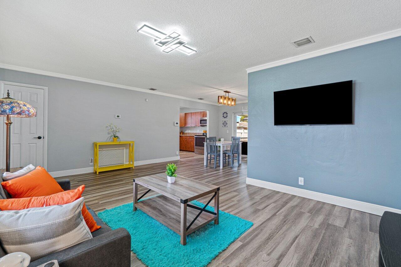 1250 Southwest 6th Avenue Deerfield Beach, FL 33441 - Photo 6 of 22 a living room with furniture and a flat screen tv
