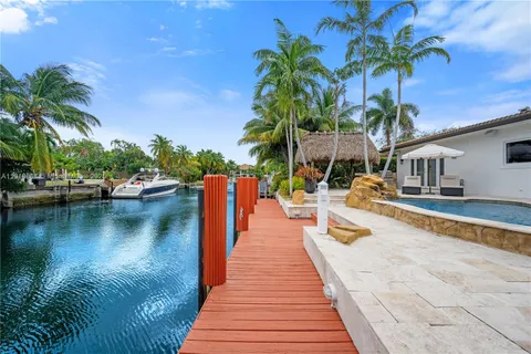 a view of a swimming pool with lounge chairs