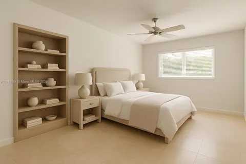 a bedroom with bed and a window