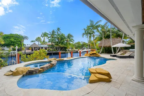 a view of a swimming pool with lounge chair