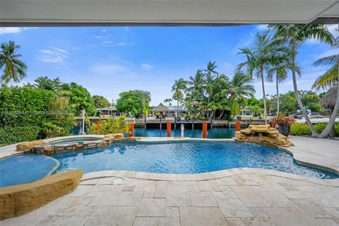 a view of a swimming pool with a patio