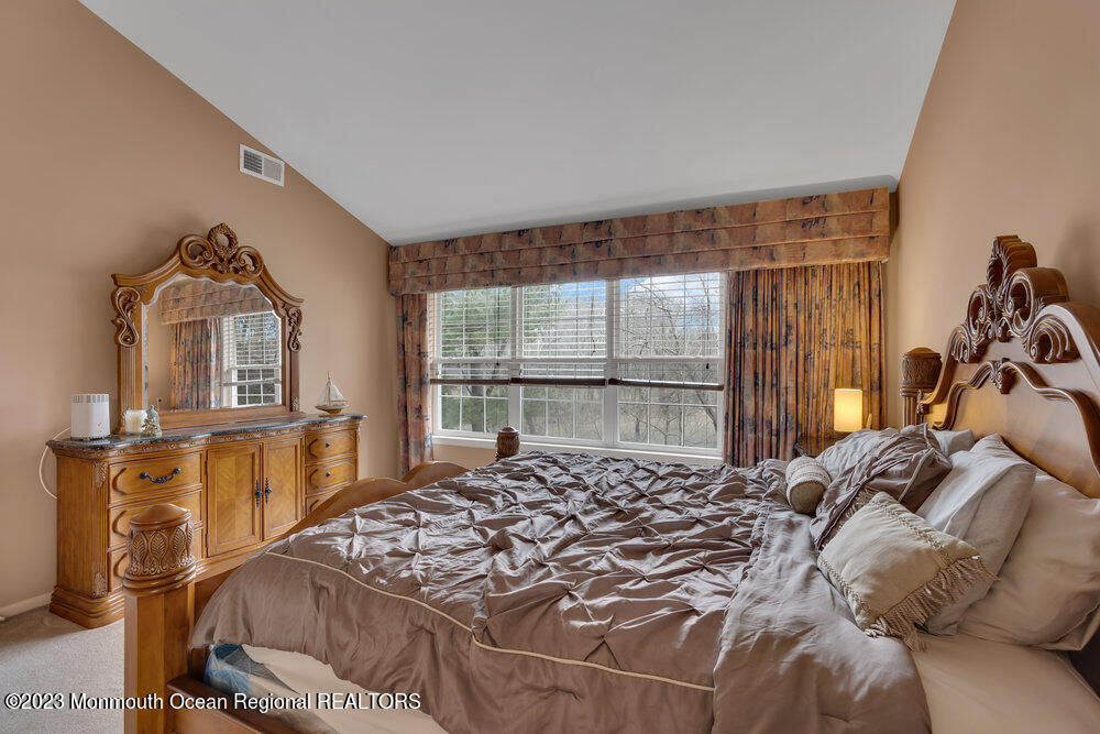 4 Blacksmith Pass Colts Neck, NJ 07722 - Photo 17 of 38 a bed sitting in a bedroom next to a window