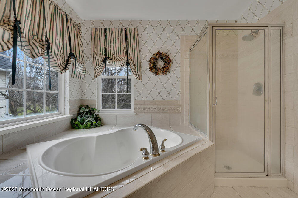 4 Blacksmith Pass Colts Neck, NJ 07722 - Photo 19 of 38 a bath tub sitting next to a window