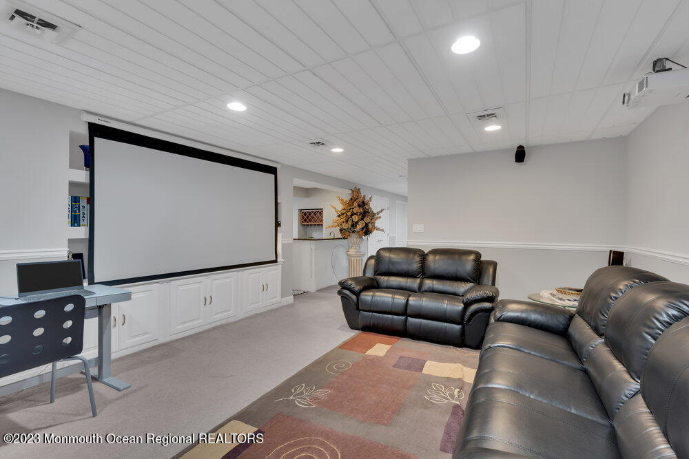 4 Blacksmith Pass Colts Neck, NJ 07722 - Photo 26 of 38 a living room with furniture and a flat screen tv