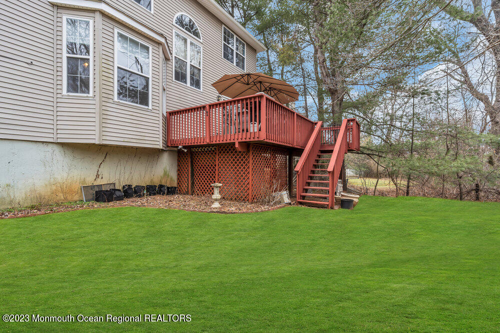 4 Blacksmith Pass Colts Neck, NJ 07722 - Photo 32 of 38 a front view of a house with a garden