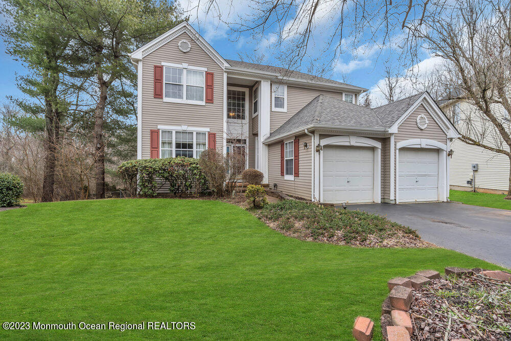 4 Blacksmith Pass Colts Neck, NJ 07722 - Photo 37 of 38 a front view of a house with a garden