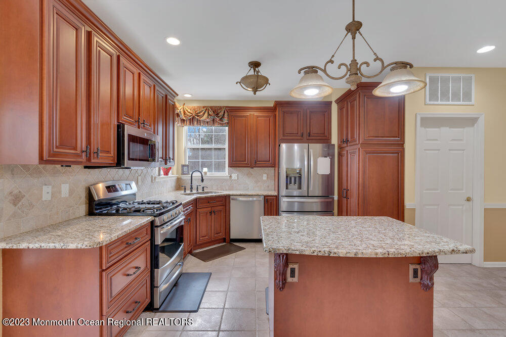 4 Blacksmith Pass Colts Neck, NJ 07722 - Photo 9 of 38 a kitchen that has a lot of cabinets in it