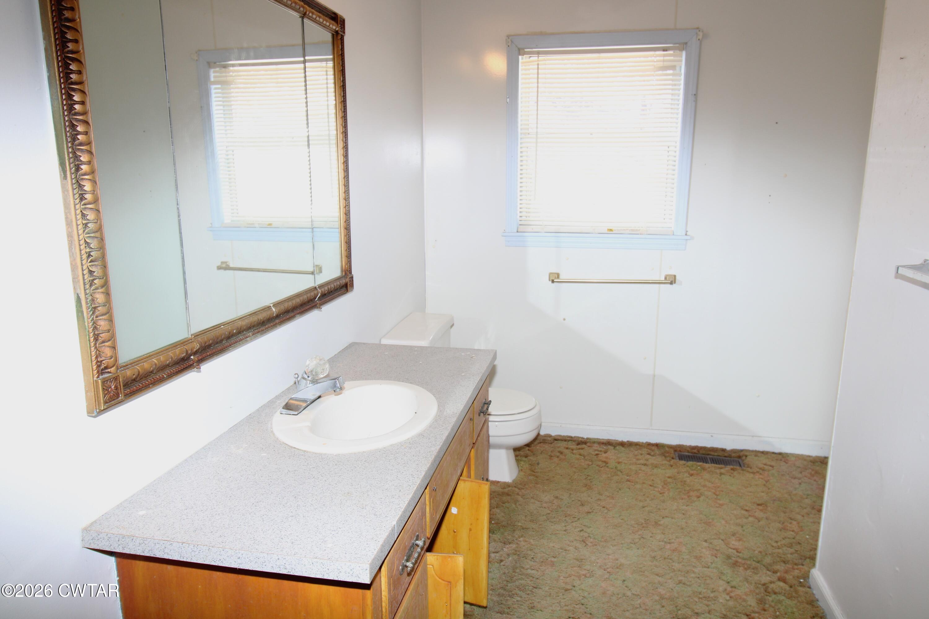 583 Broad Street North Lexington, TN 38351 - Photo 7 of 14 a bathroom with a sink and a mirror