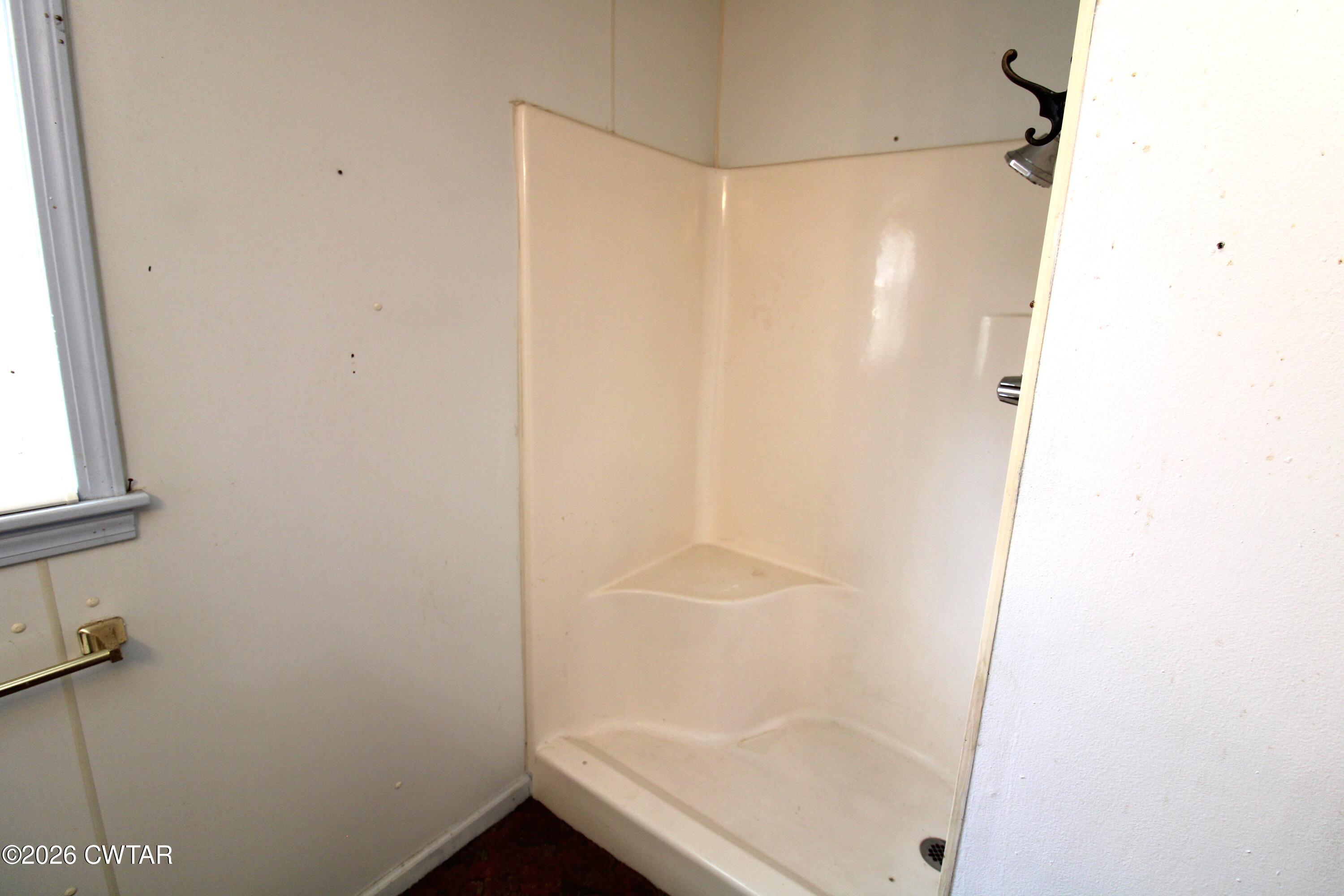 583 Broad Street North Lexington, TN 38351 - Photo 8 of 14 a bathroom with a shower