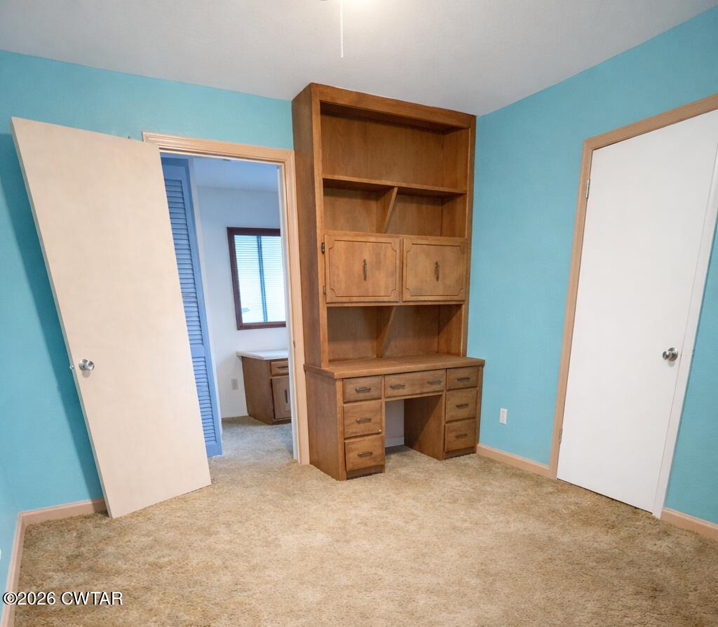 583 Broad Street North Lexington, TN 38351 - Photo 10 of 14 a room with a wooden closet and washing machine