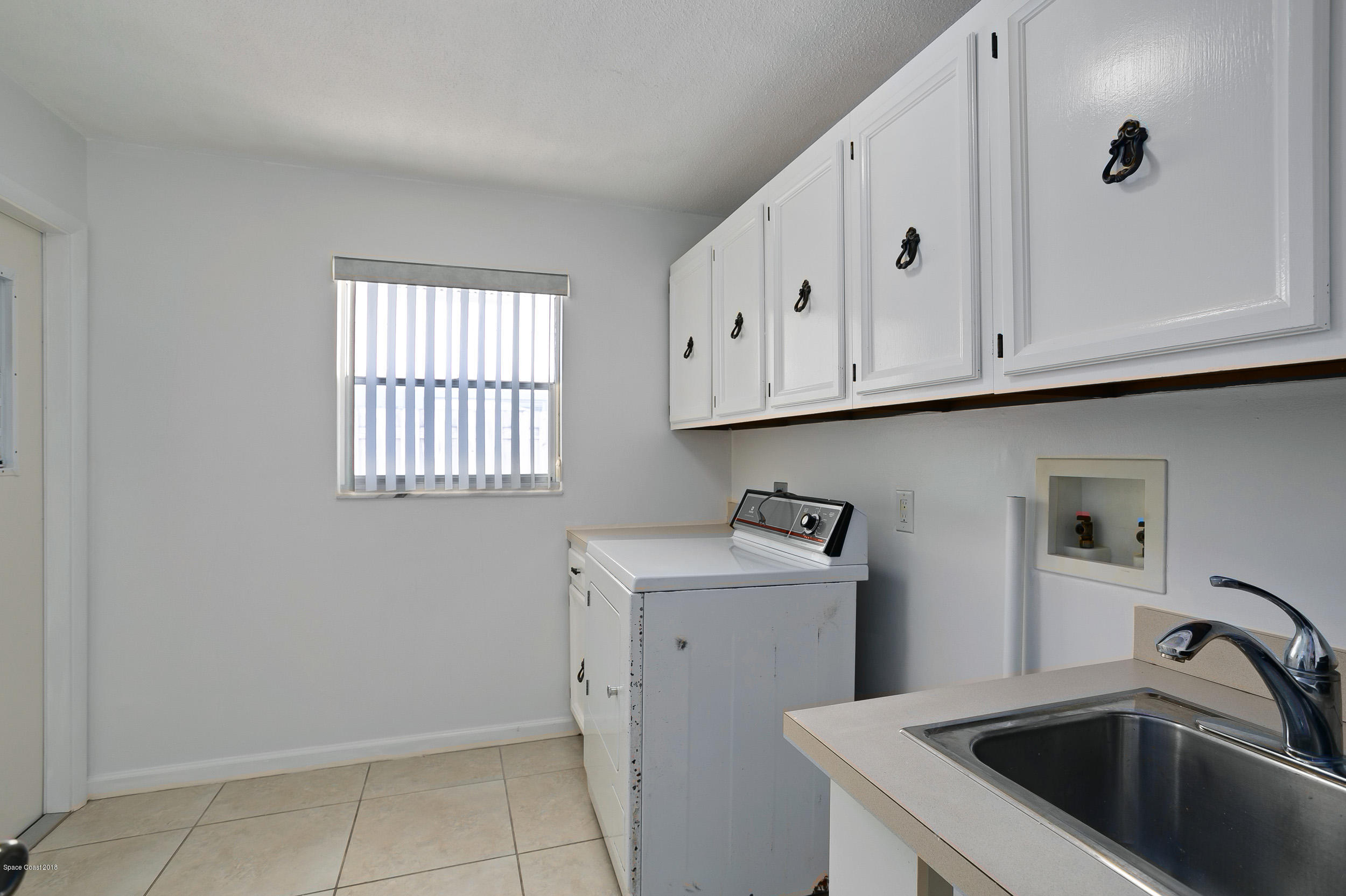 120 La Riviere Road Cocoa Beach, FL 32931 - Photo 17 of 33 Laundry Room