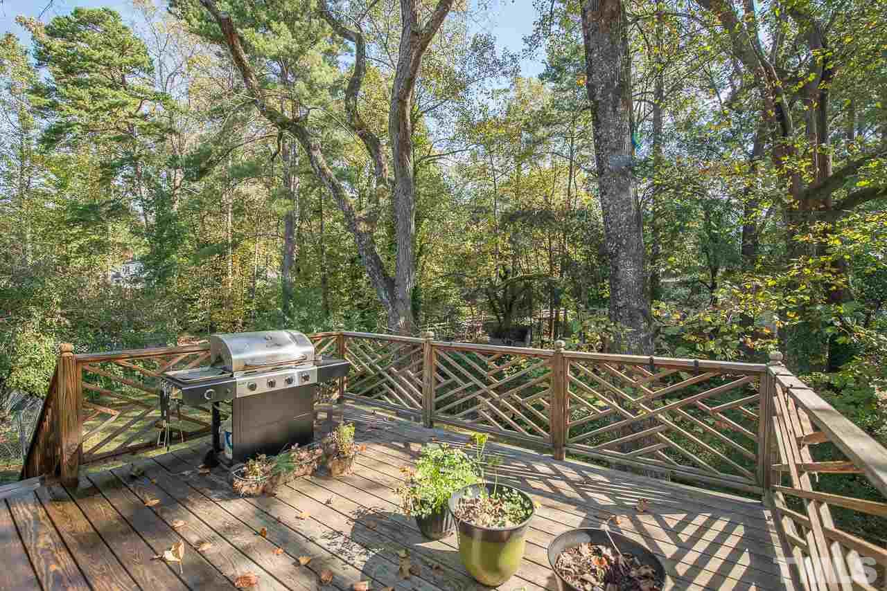 1924 Quail Ridge Road Raleigh, NC 27609 - Photo 22 of 25 a view of a patio with table and chairs and wooden floor