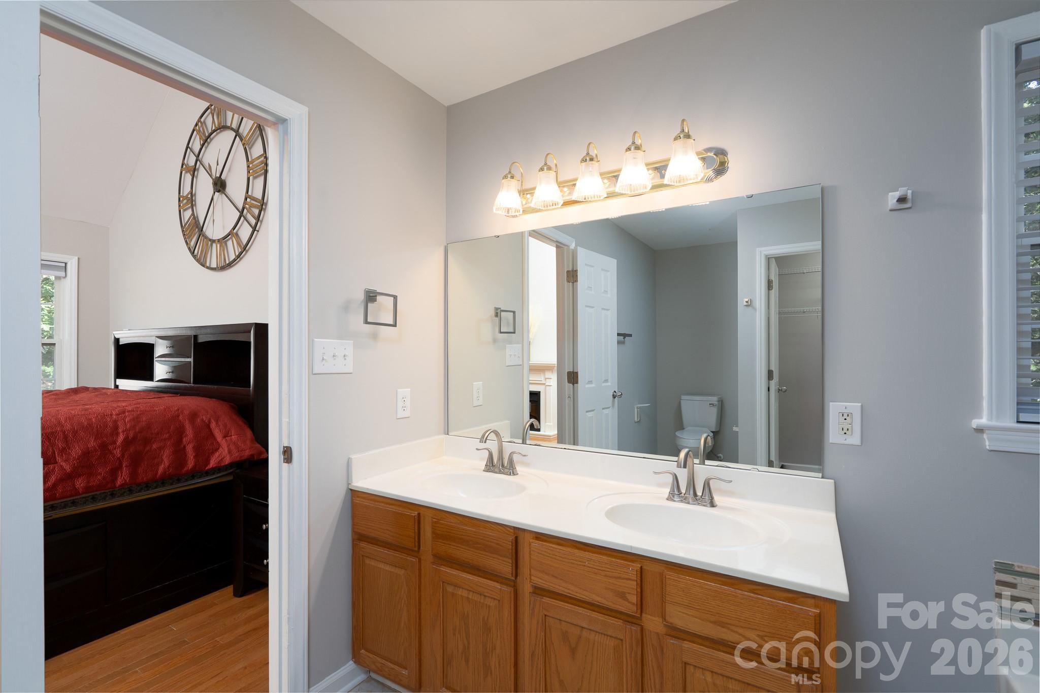 5356 Zion Church Road Concord, NC 28025 - Photo 21 of 46 a en suite bathroom with a sink and a mirror