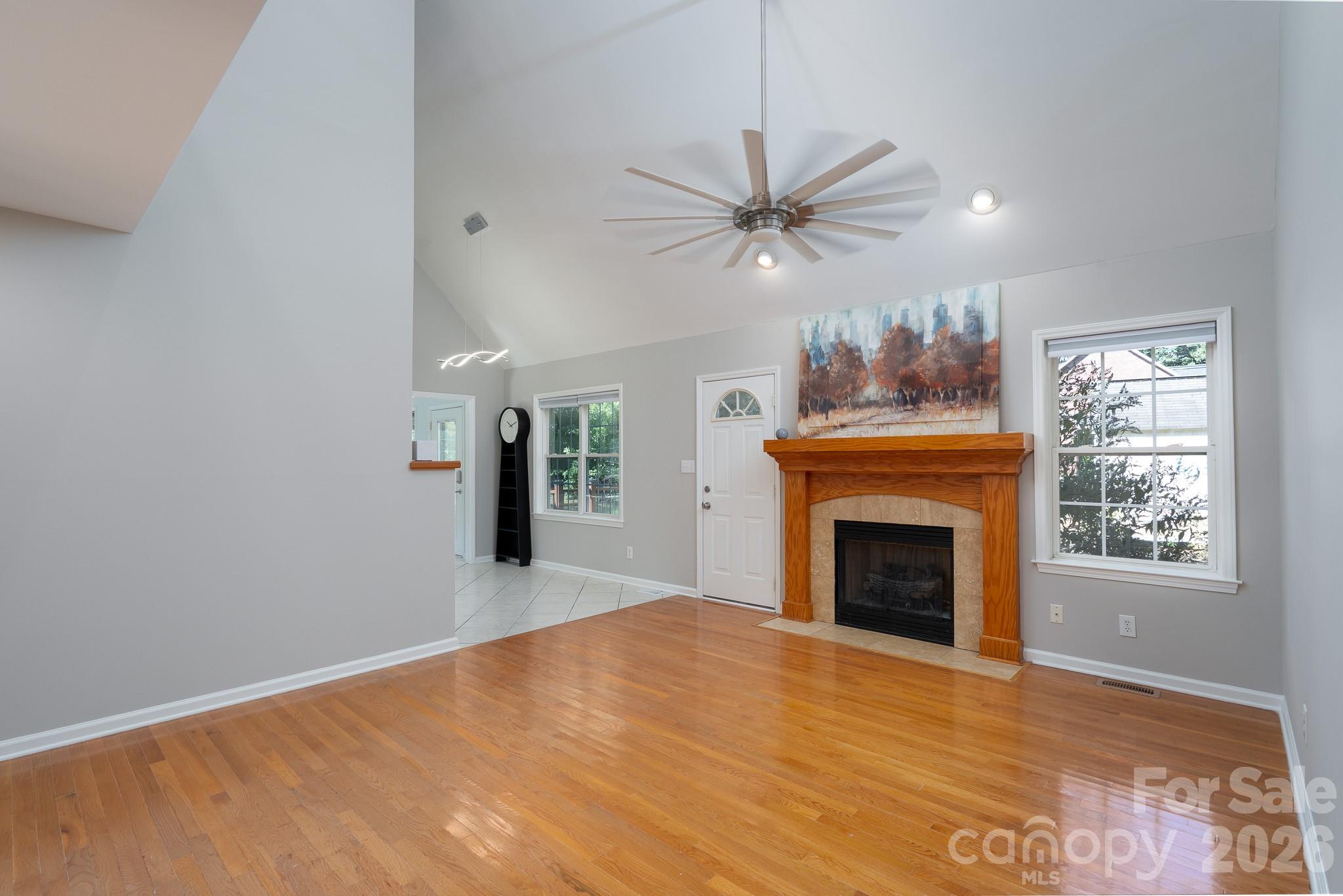 5356 Zion Church Road Concord, NC 28025 - Photo 8 of 46 a view of empty room with fireplace fan and windows