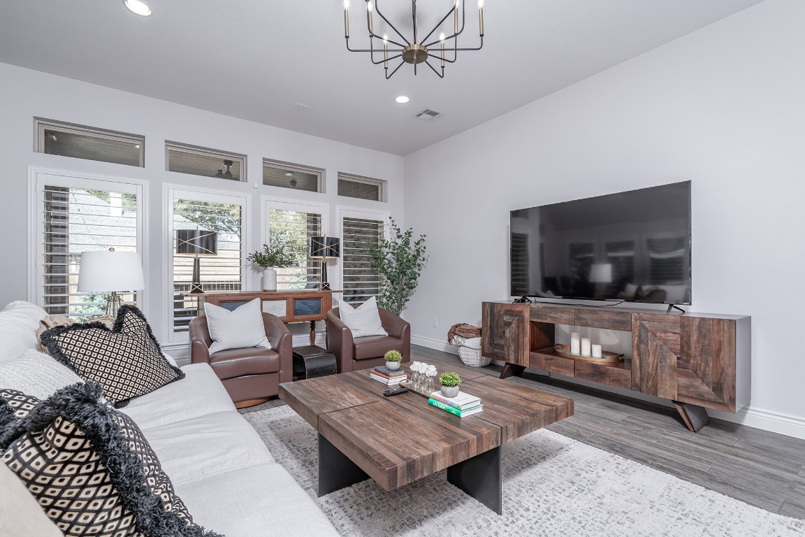 1232 Lakeside Ranch Road Georgetown, TX 78633 - Photo 11 of 31 a living room with furniture and a flat screen tv