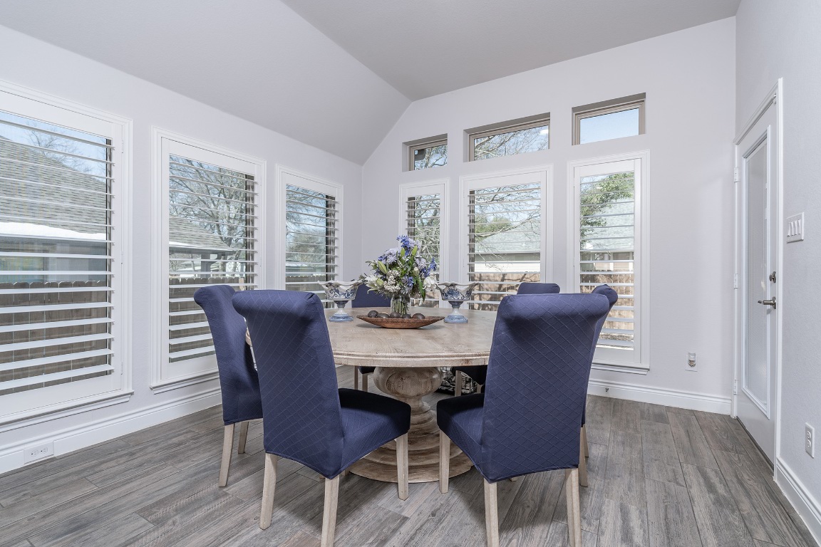 1232 Lakeside Ranch Road Georgetown, TX 78633 - Photo 18 of 31 a view of a dining room with furniture window and wooden floor