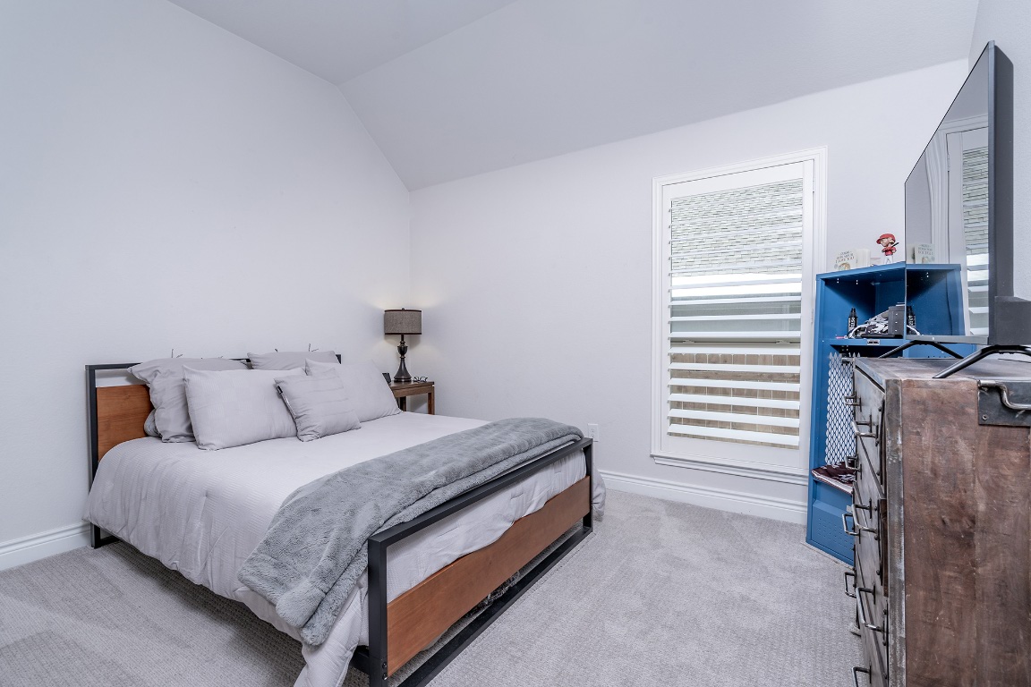 1232 Lakeside Ranch Road Georgetown, TX 78633 - Photo 26 of 31 a bedroom with a bed and a window