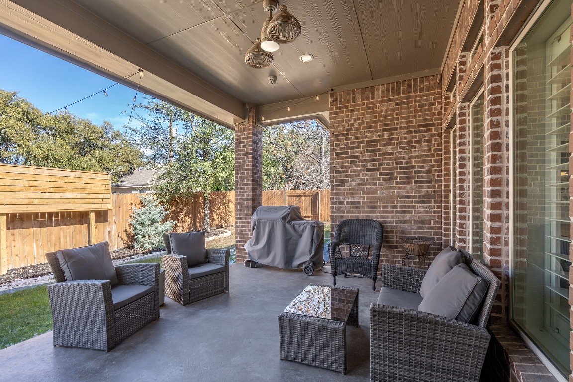 1232 Lakeside Ranch Road Georgetown, TX 78633 - Photo 28 of 31 a living room with furniture and a large window