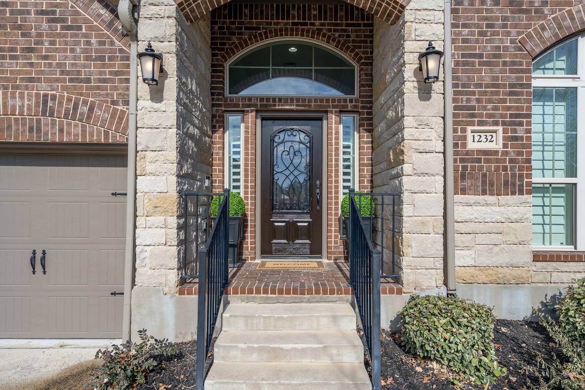 1232 Lakeside Ranch Road Georgetown, TX 78633 - Photo 4 of 31 a front view of a house with a entrance