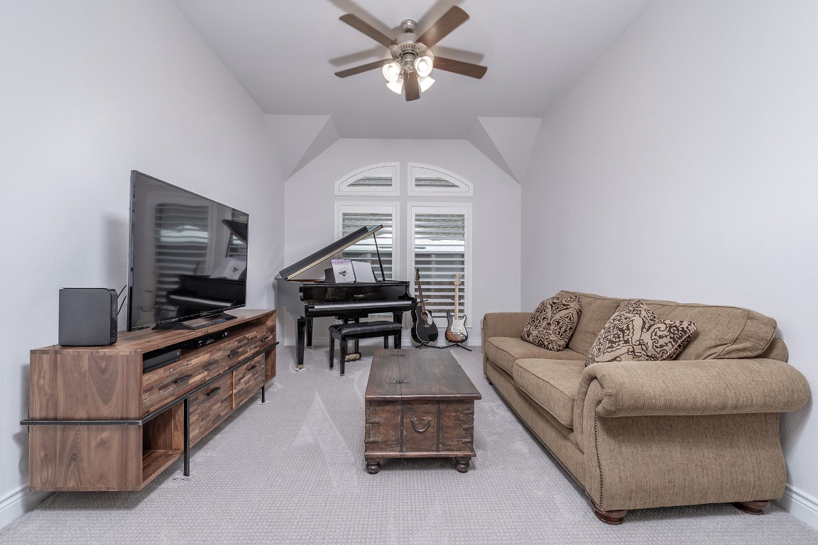 1232 Lakeside Ranch Road Georgetown, TX 78633 - Photo 9 of 31 a living room with furniture and a flat screen tv