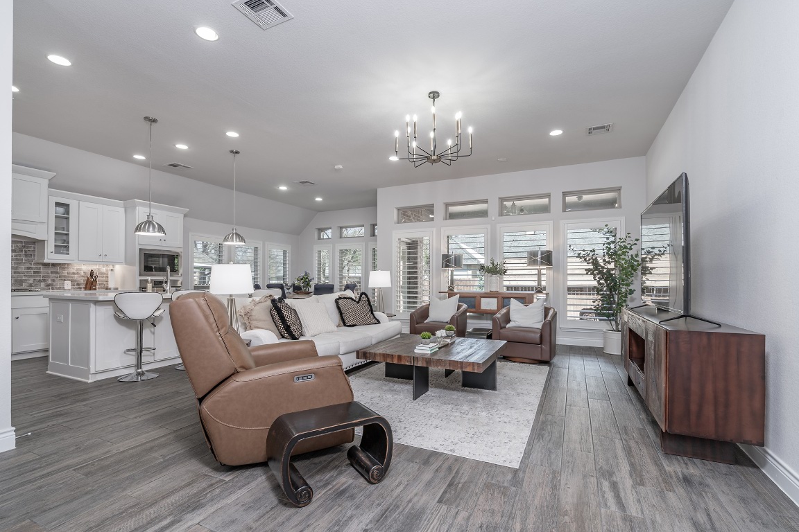 1232 Lakeside Ranch Road Georgetown, TX 78633 - Photo 10 of 31 a living room with furniture kitchen view and a wooden floor