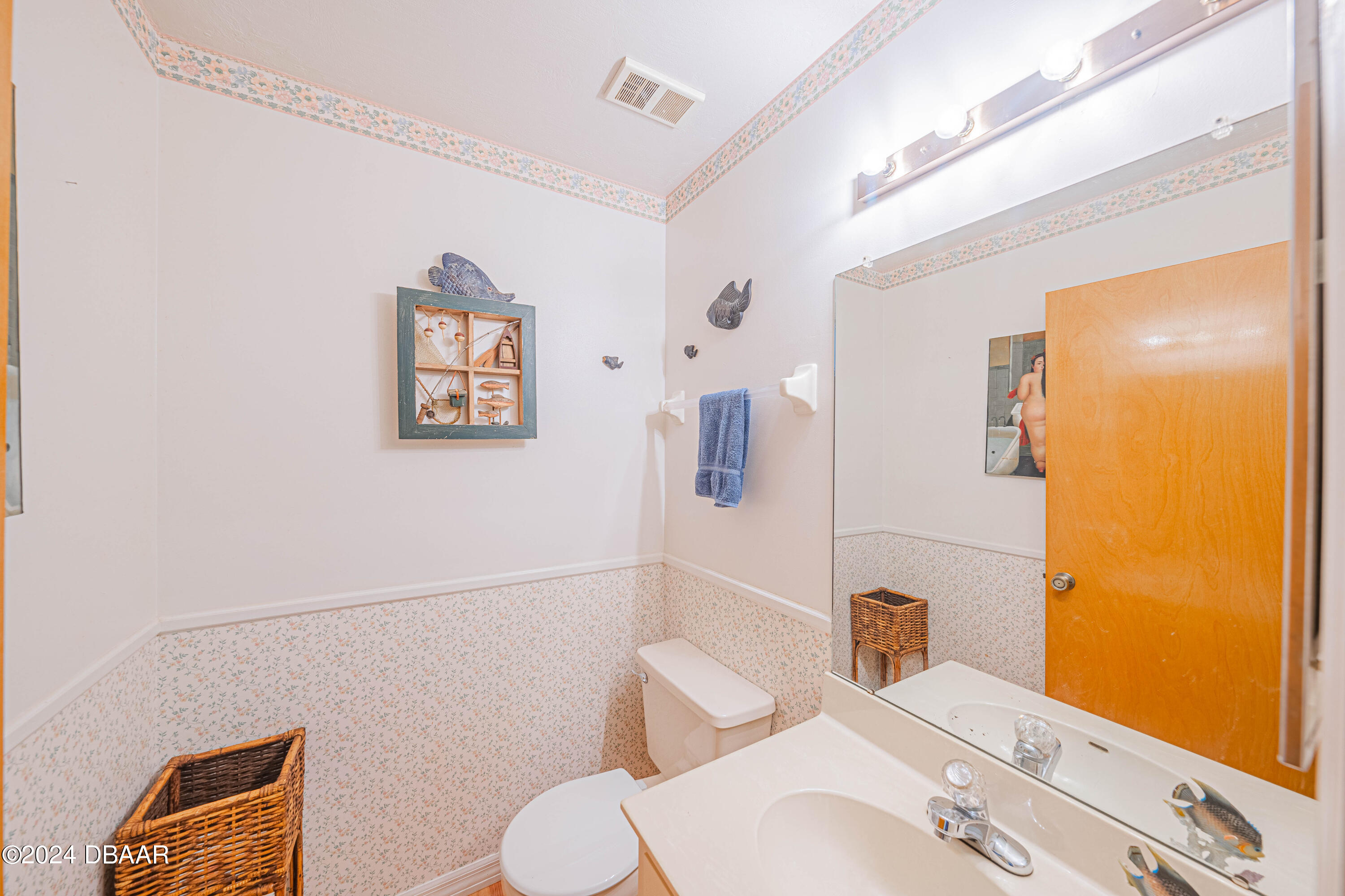 42 Jana Drive Ponce Inlet, FL 32127 - Photo 19 of 34 a bathroom with a sink mirror vanity and toilet