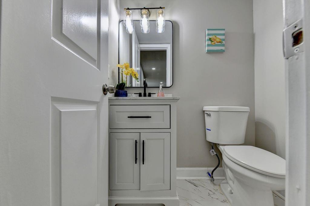 2503 Terrace Trail Decatur, GA 30035 - Photo 25 of 45 a bathroom with a toilet a sink and mirror