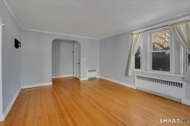 a view of an empty room with a window