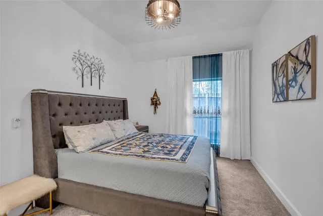 a view of a room with wooden floor and windows