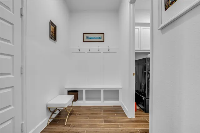 a view of a livingroom with furniture and a ceiling fan